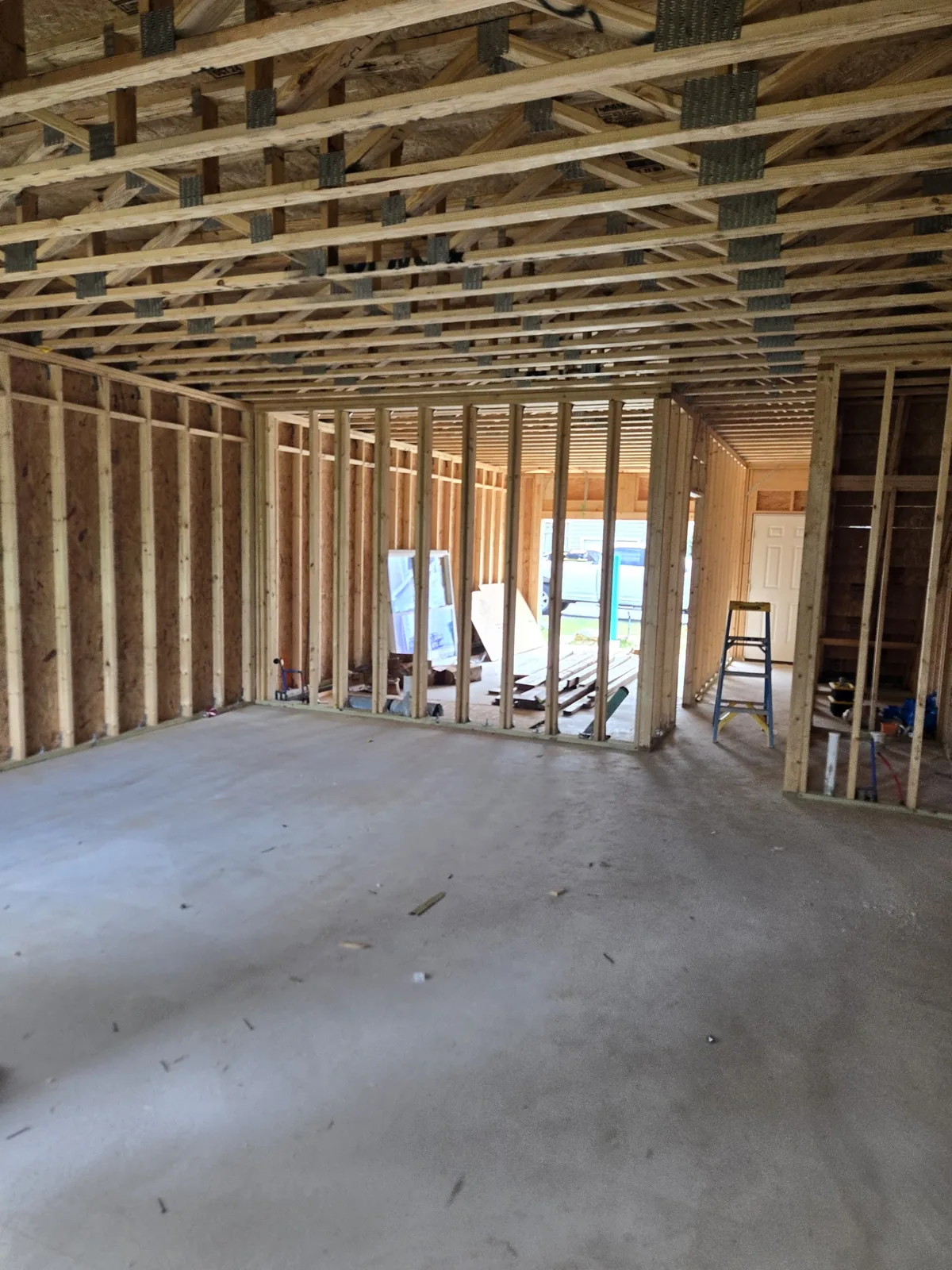 Open wood framing during a new-home electrical rough-in